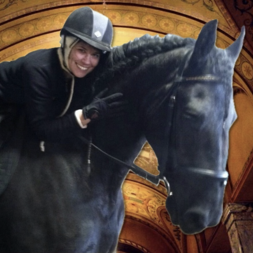 Author hugging a black horse