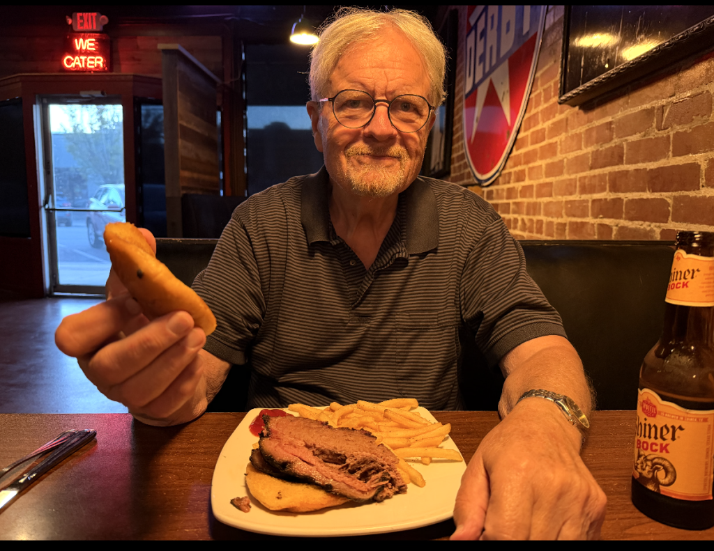 Author eating barbecue at Eat Me Barbecue in Wichita Kansas